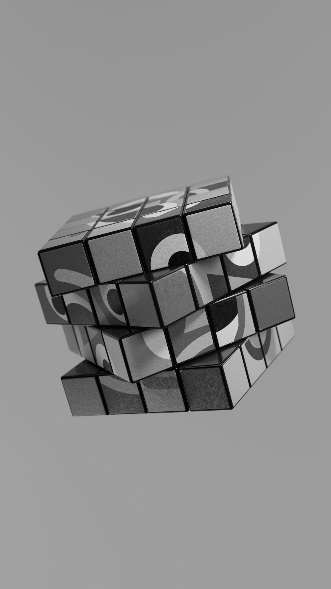 A colourful abstract puzzle cube mid-turn, shown in greyscale